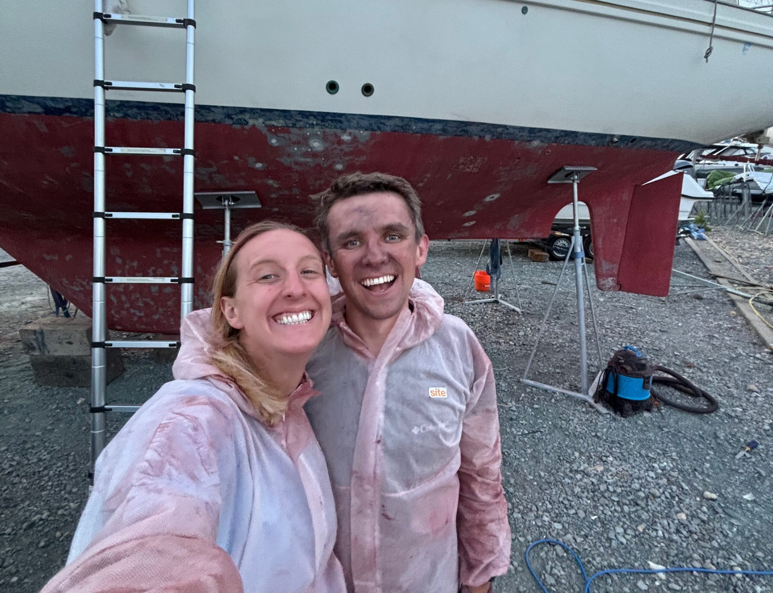 Fran and Jack covered in antifoul dust after a day of sanding