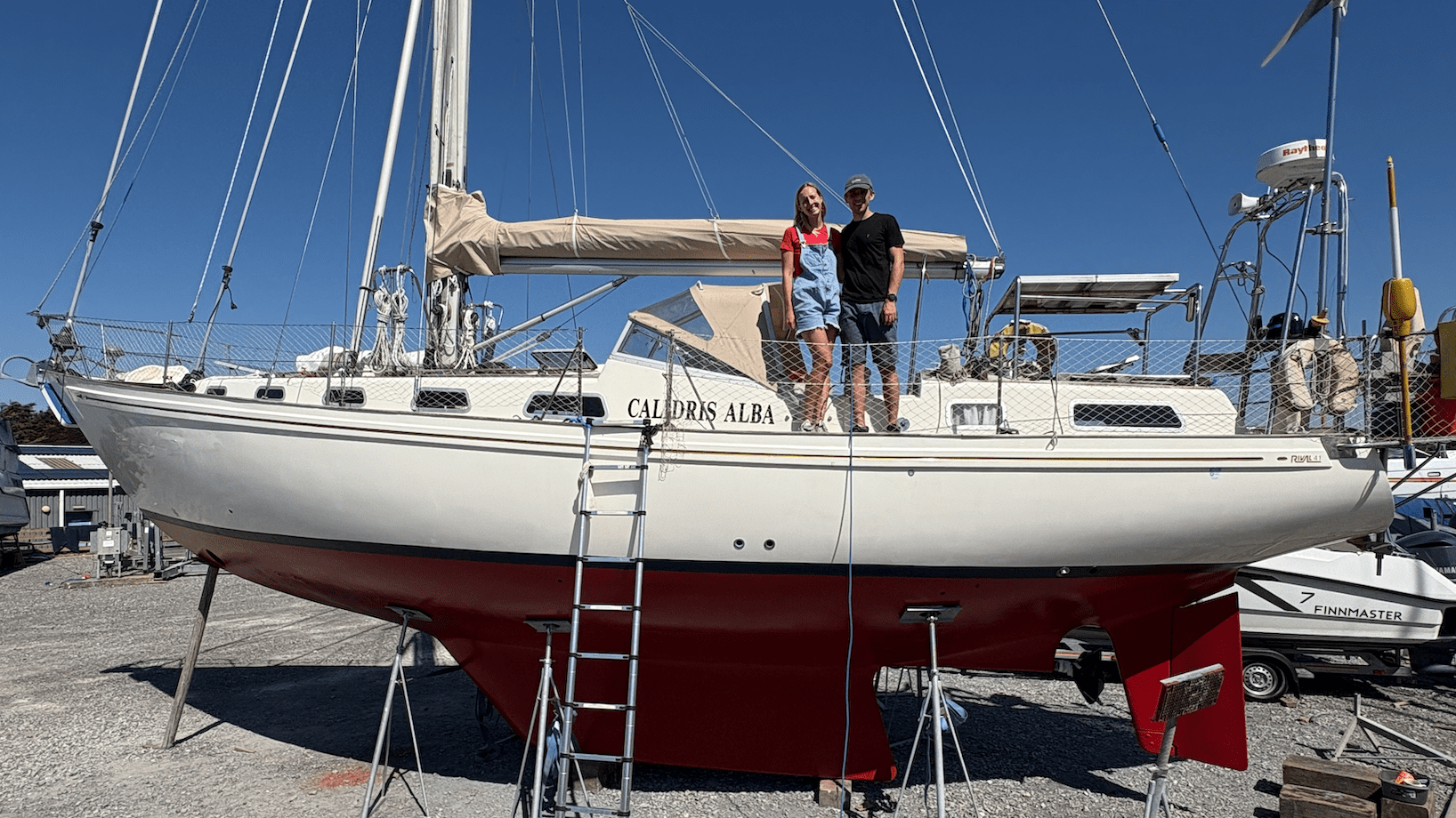 Fran and Jack standing on Calidris Alba in the boatyard