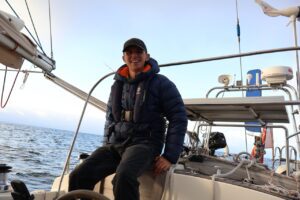 Jack sitting in the cockpit smiling