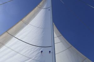 Both head sails poled out on each side